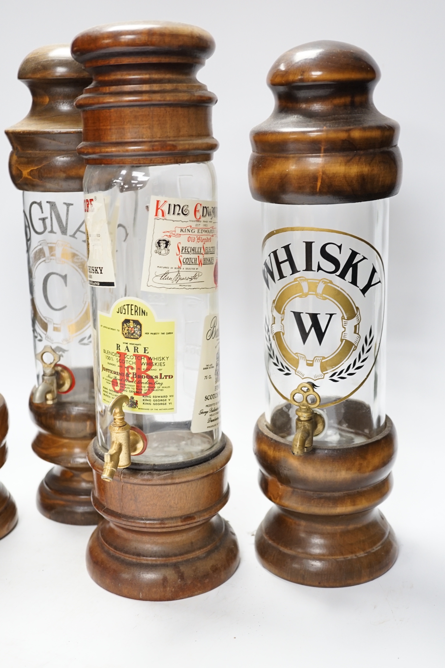 Four spirit vessels, whisky, pastis, cognac, and another, tallest, 38cm